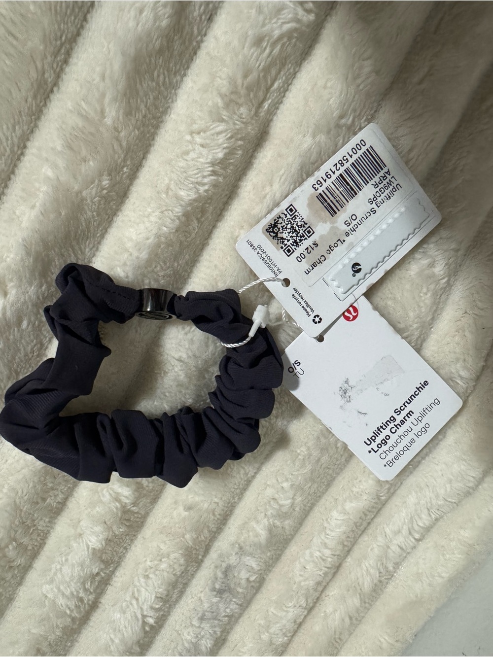 Uplifting scrunchie with logo charm